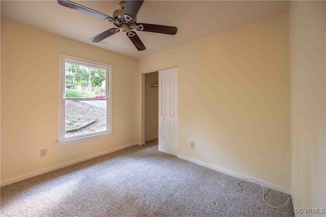10313 Natural Bridge Road North Chesterfield, VA 23236 - Photo 24 of 31 an empty room with windows and fan
