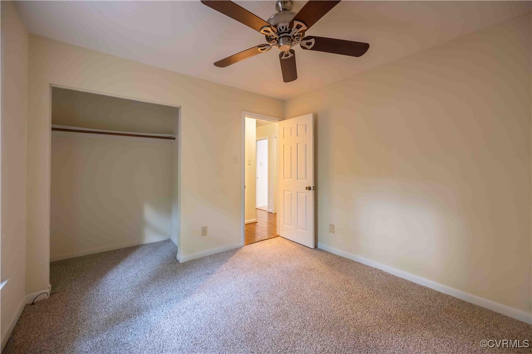 10313 Natural Bridge Road North Chesterfield, VA 23236 - Photo 25 of 31 an empty room with a ceiling fan and a window