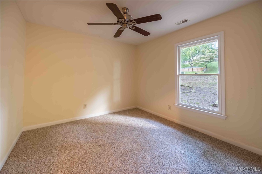 10313 Natural Bridge Road North Chesterfield, VA 23236 - Photo 26 of 31 an empty room with a window and a fan