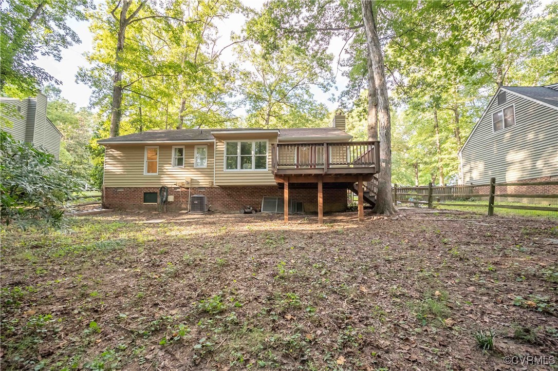 10313 Natural Bridge Road North Chesterfield, VA 23236 - Photo 30 of 31 a front view of a house with a garden and trees