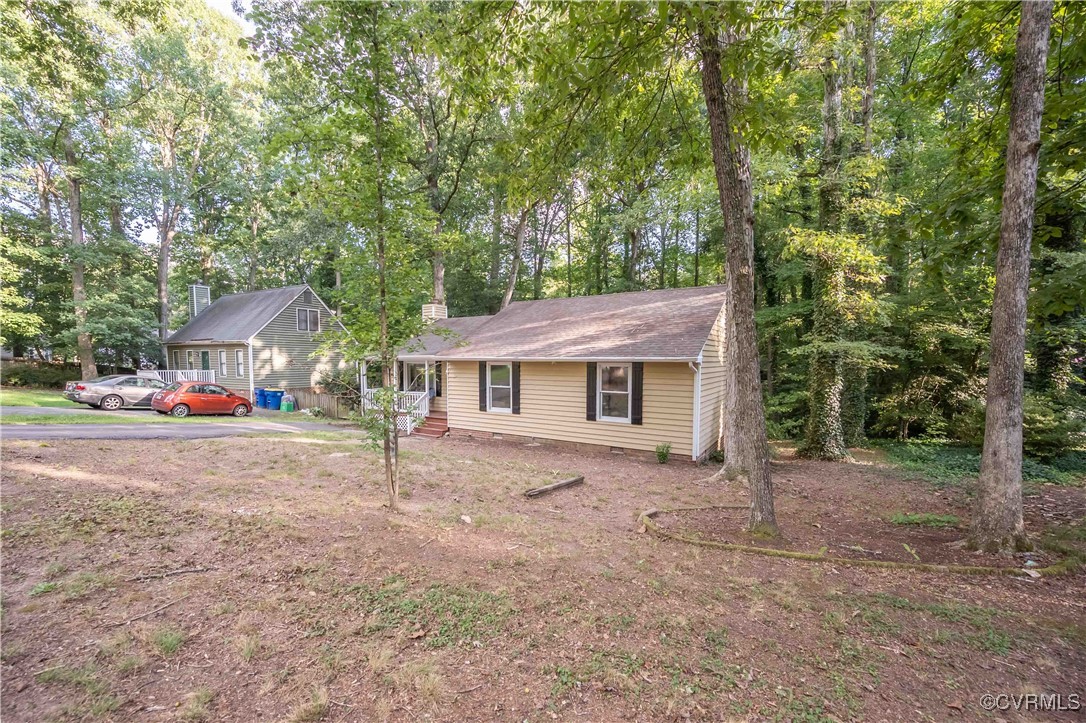 10313 Natural Bridge Road North Chesterfield, VA 23236 - Photo 4 of 31 front view of a house with a tree in the yard