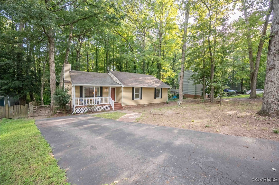 10313 Natural Bridge Road North Chesterfield, VA 23236 - Photo 5 of 31 a front view of a house with garden