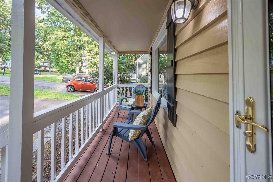 10313 Natural Bridge Road North Chesterfield, VA 23236 - Photo 6 of 31 a view of a balcony with chairs and wooden floor