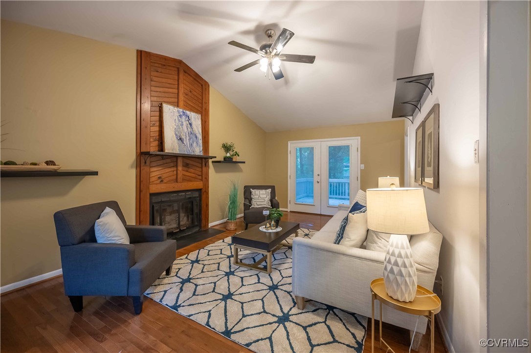 10313 Natural Bridge Road North Chesterfield, VA 23236 - Photo 7 of 31 a living room with furniture fireplace and a table