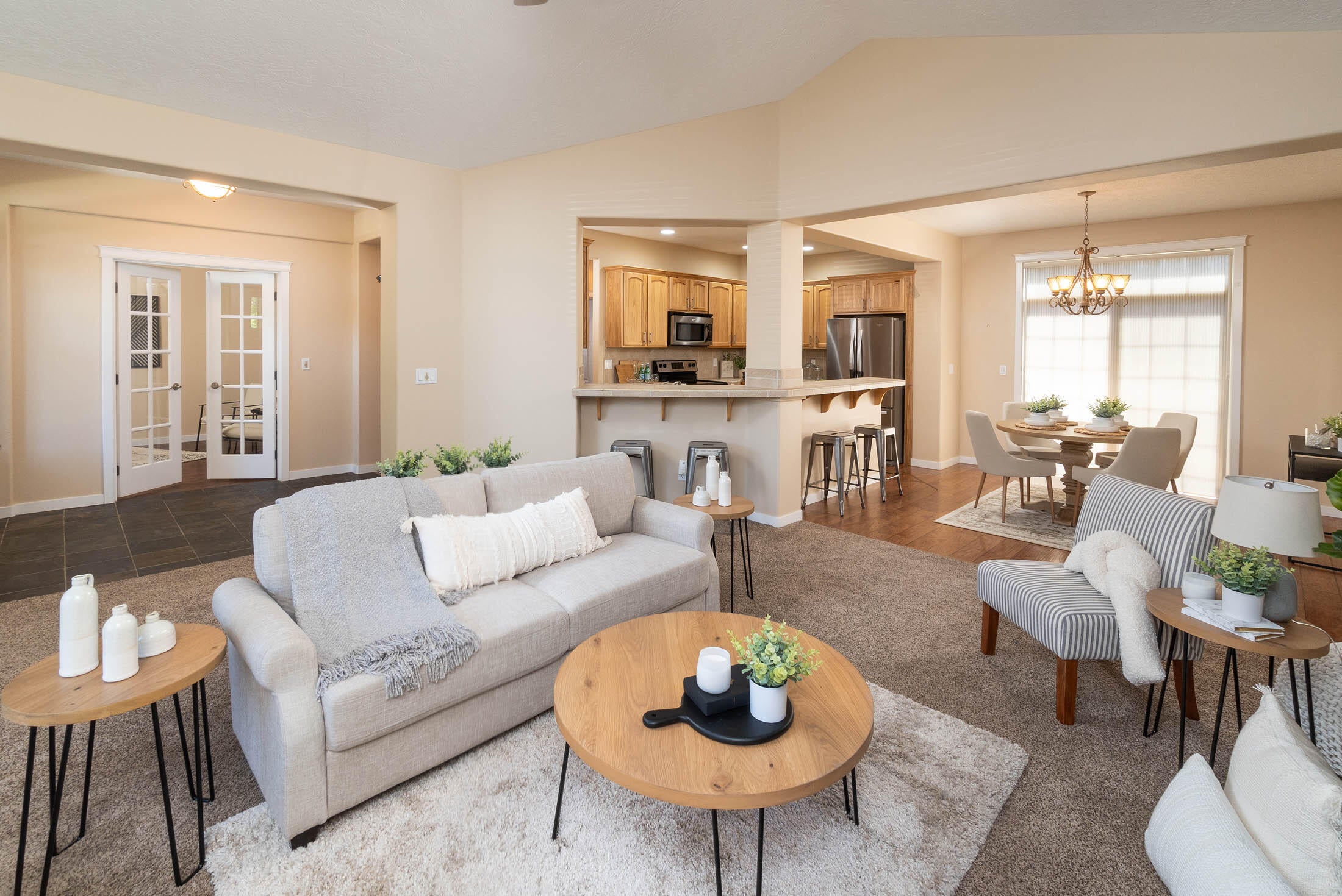 852 Northwest Rimrock Drive Redmond, OR 97756 - Photo 5 of 22 Behind sofa is the slate entryway with double doors to the bonus room.