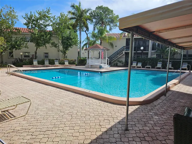 a view of a house with swimming pool