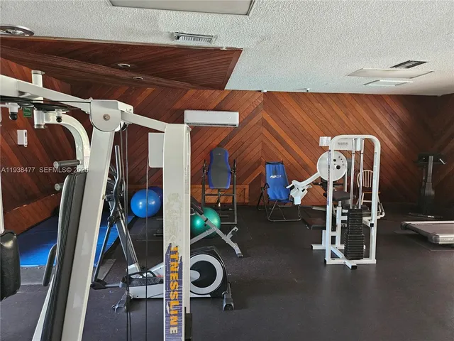 walk in closet with wooden floor