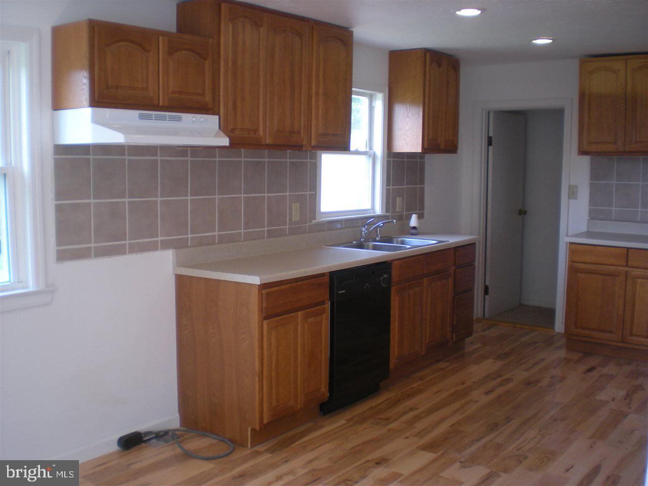 1588 Trolley Road Hanover, PA 17331 - Photo 12 of 31 a kitchen with a sink cabinets and wooden floor