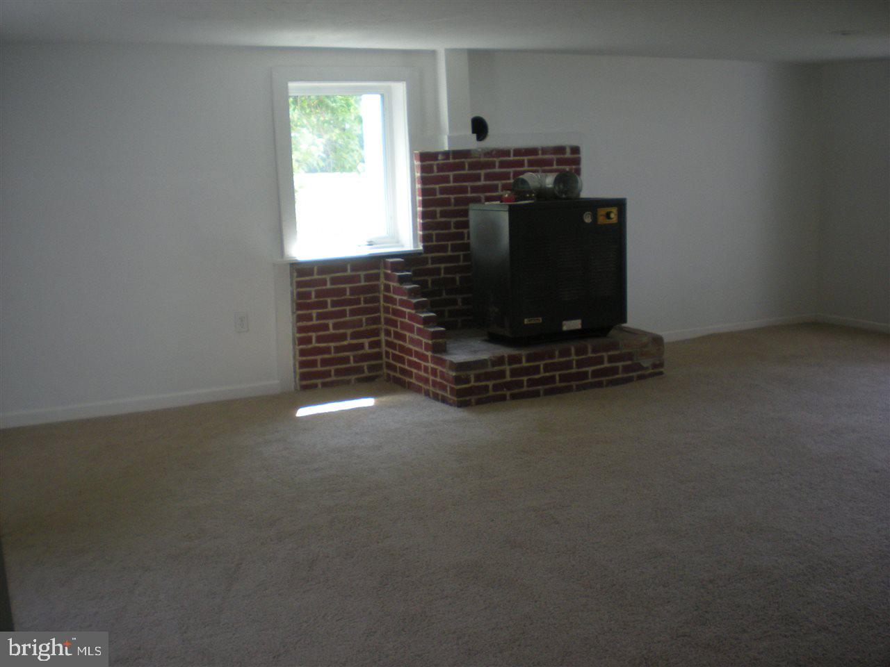 1588 Trolley Road Hanover, PA 17331 - Photo 24 of 31 a living room with a fireplace