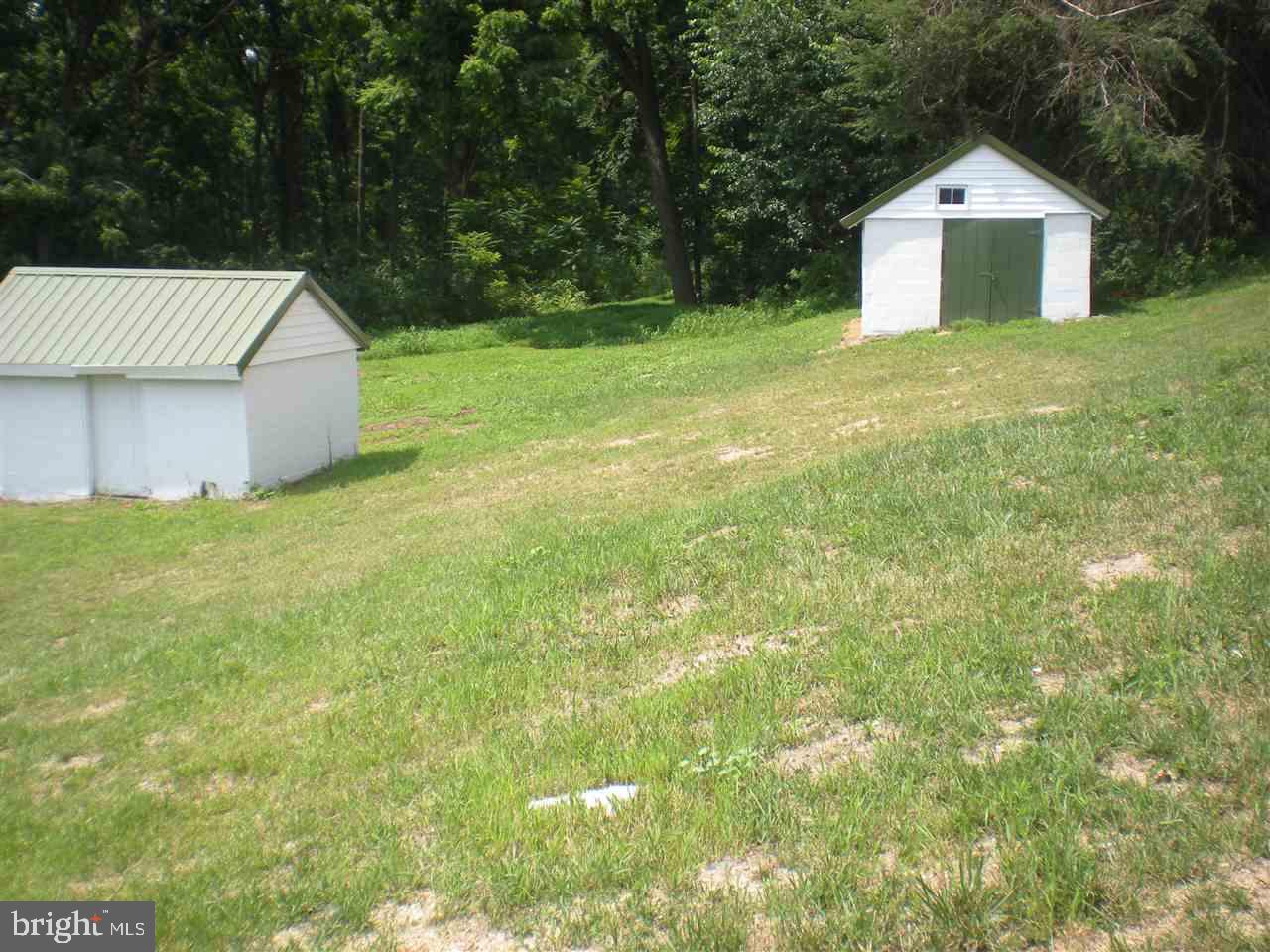 1588 Trolley Road Hanover, PA 17331 - Photo 31 of 31 a front view of a house with a yard and trees