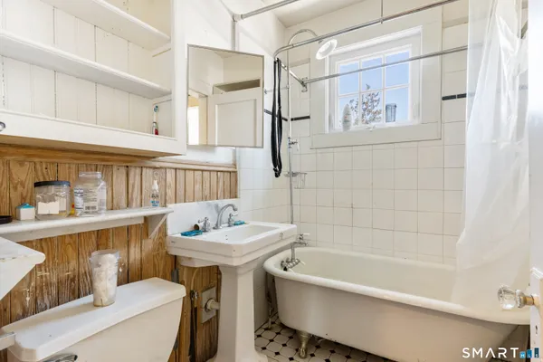 a bathroom with a sink toilet and bathtub