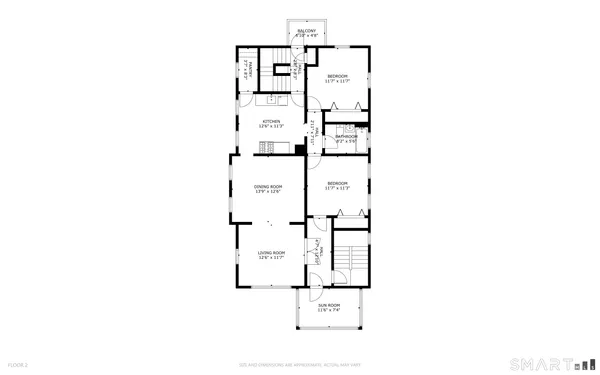 a view of a building with snow on the road