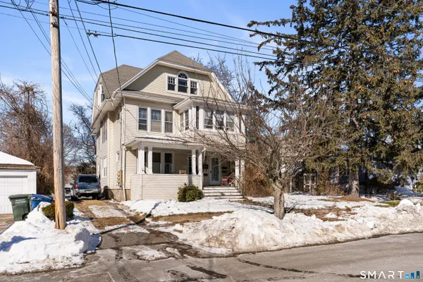 a large building with a large tree in front of it