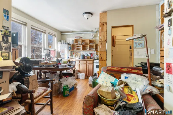 a white toilet sitting next to a bathroom sink and tub