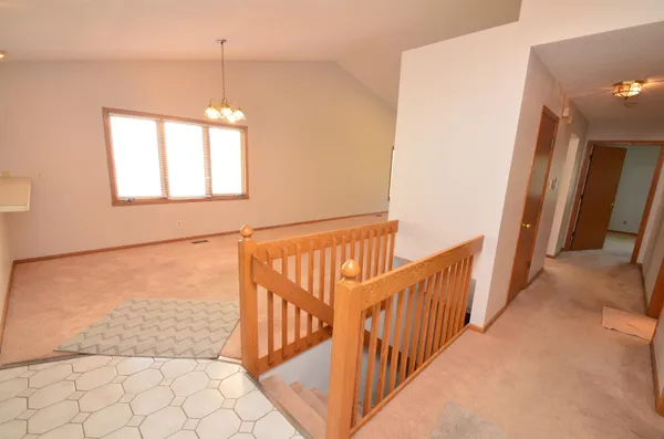 a view of a hallway with windows