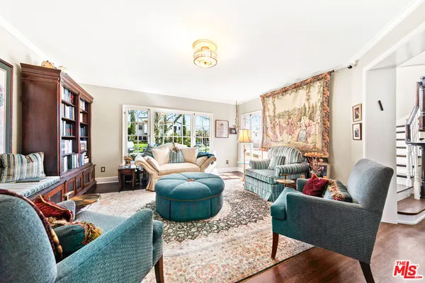 a kitchen with granite countertop a stove a sink and a window
