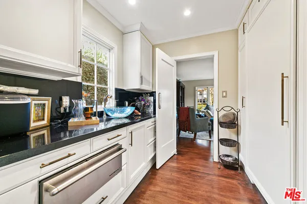 a bedroom with bed and a window