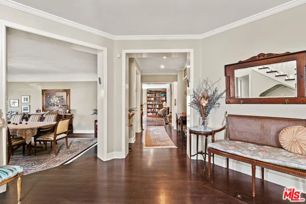 a view of entryway with wooden floor and stairs