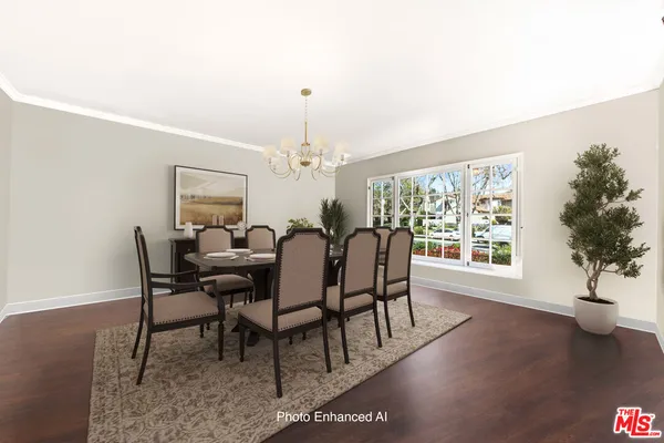 a living room with furniture a rug and a large window