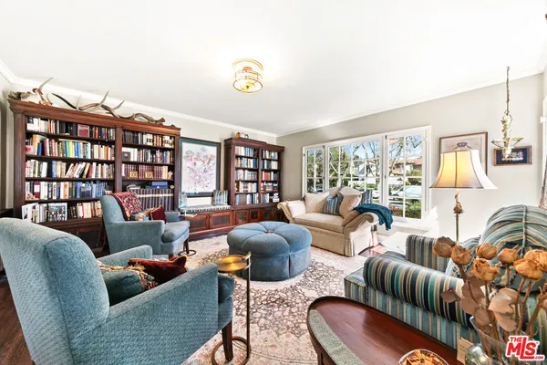 a bathroom with a sink a mirror and a shower curtain