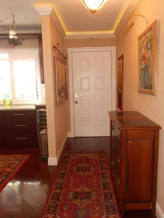 a view of a door with wooden floor