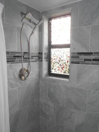 a bathroom with a toilet sink and shower