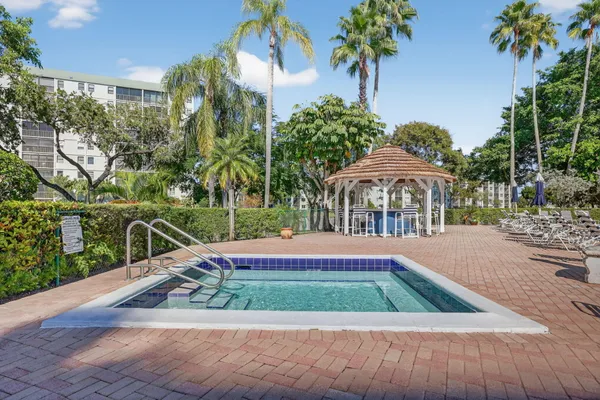 a view of a backyard with sitting area