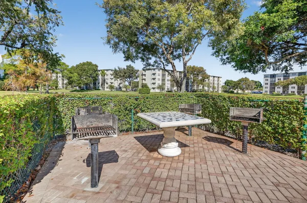 a view of a swimming pool with a bench