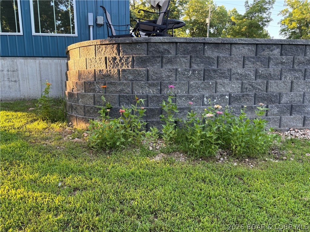 27444 Golden Beach Road Barnett, MO 65011 - Photo 30 of 42 Flowers surround the retaining wall