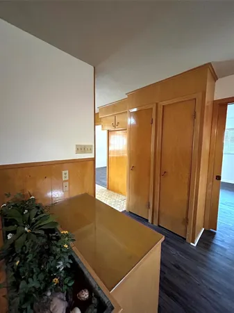 a view of an empty room and wooden floor