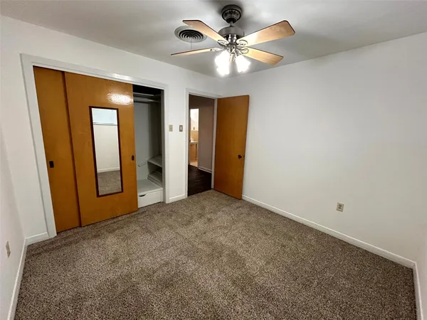 an empty room with a bathroom