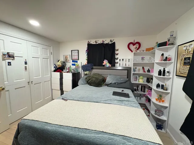 a bed room with a bed and a television