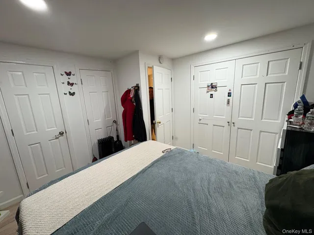 a bed room with a bed and a mirror