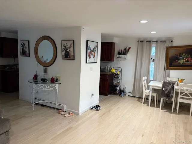 a view of a livingroom with furniture and a flat screen tv
