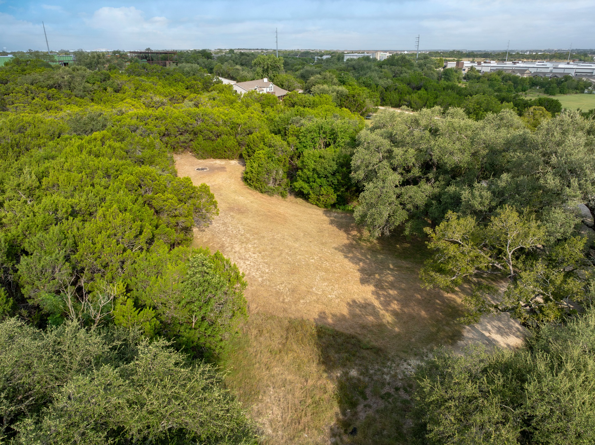 5021 Little Valley Road Leander, TX 78641 - Photo 21 of 32 Aerial context view of mature tree canopy, area pathways, and nearby roads.