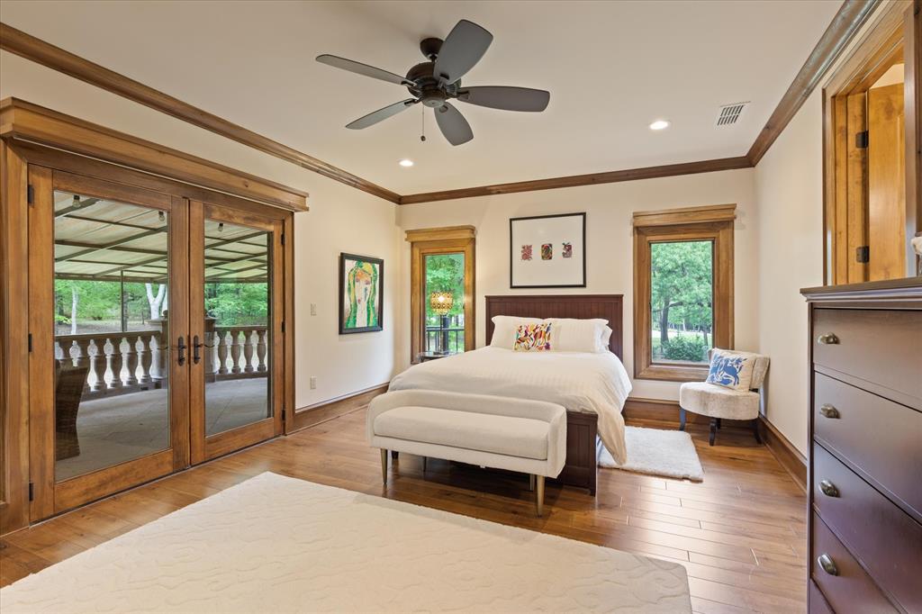 3705 Champions Ridge Lane Longview, TX 75605 - Photo 27 of 40 a bedroom with a large bed and a large window