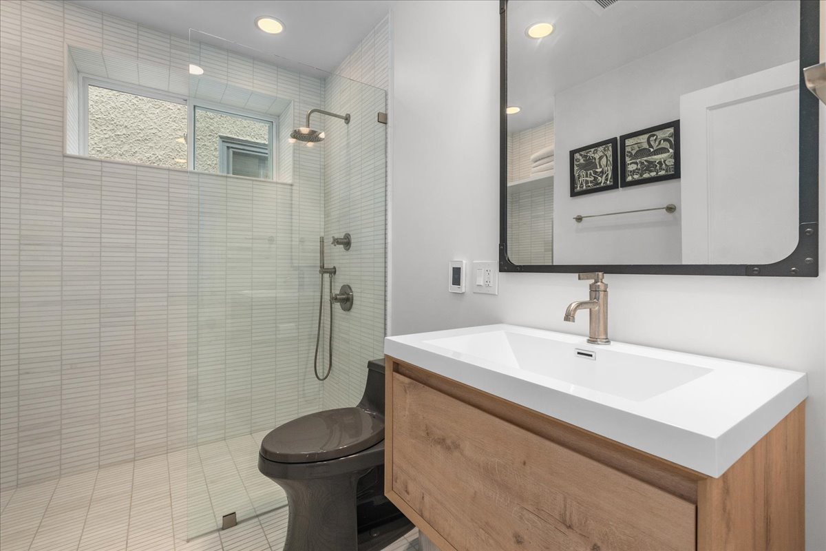 2087 West Greenleaf Avenue Chicago, IL 60645 - Photo 26 of 35 a bathroom with a sink toilet and shower
