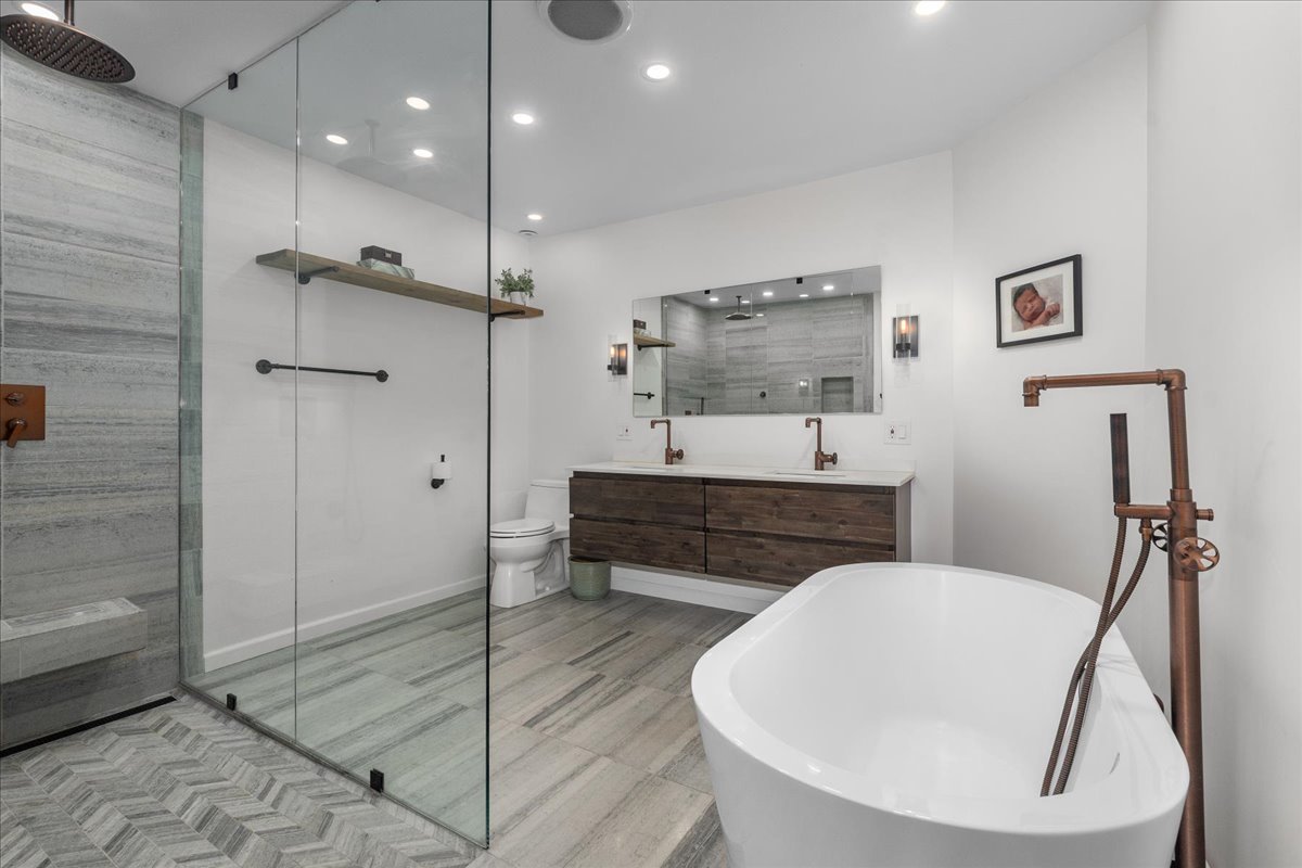 2087 West Greenleaf Avenue Chicago, IL 60645 - Photo 28 of 35 a bathroom with a sink a toilet and shower