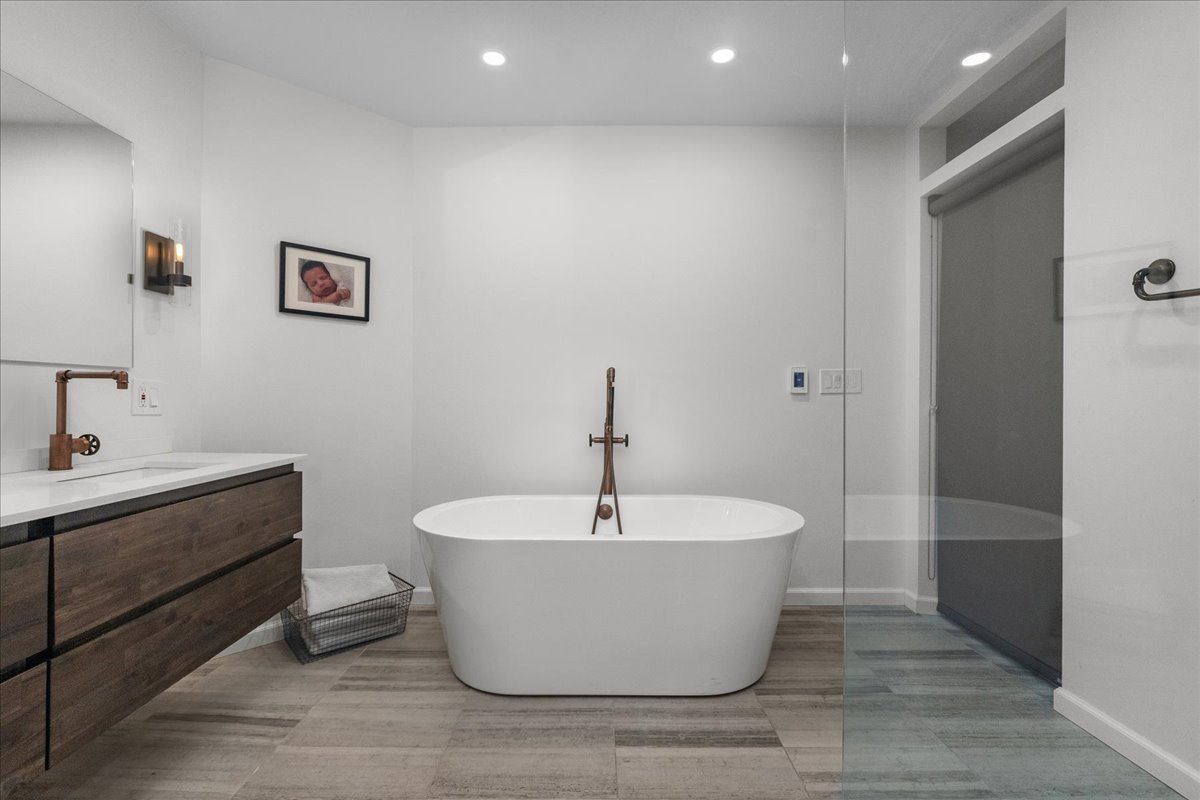 2087 West Greenleaf Avenue Chicago, IL 60645 - Photo 29 of 35 a white bath tub sitting in a bathroom