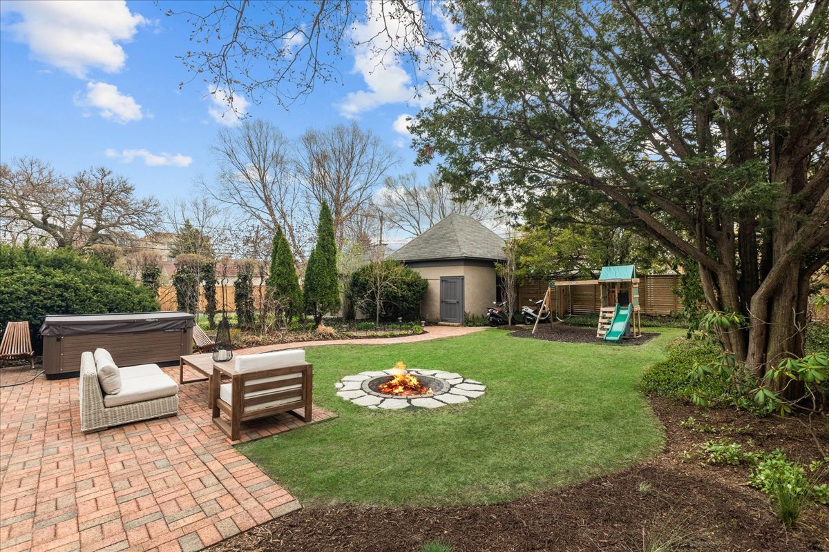 2087 West Greenleaf Avenue Chicago, IL 60645 - Photo 4 of 35 a front view of a house with garden and trees