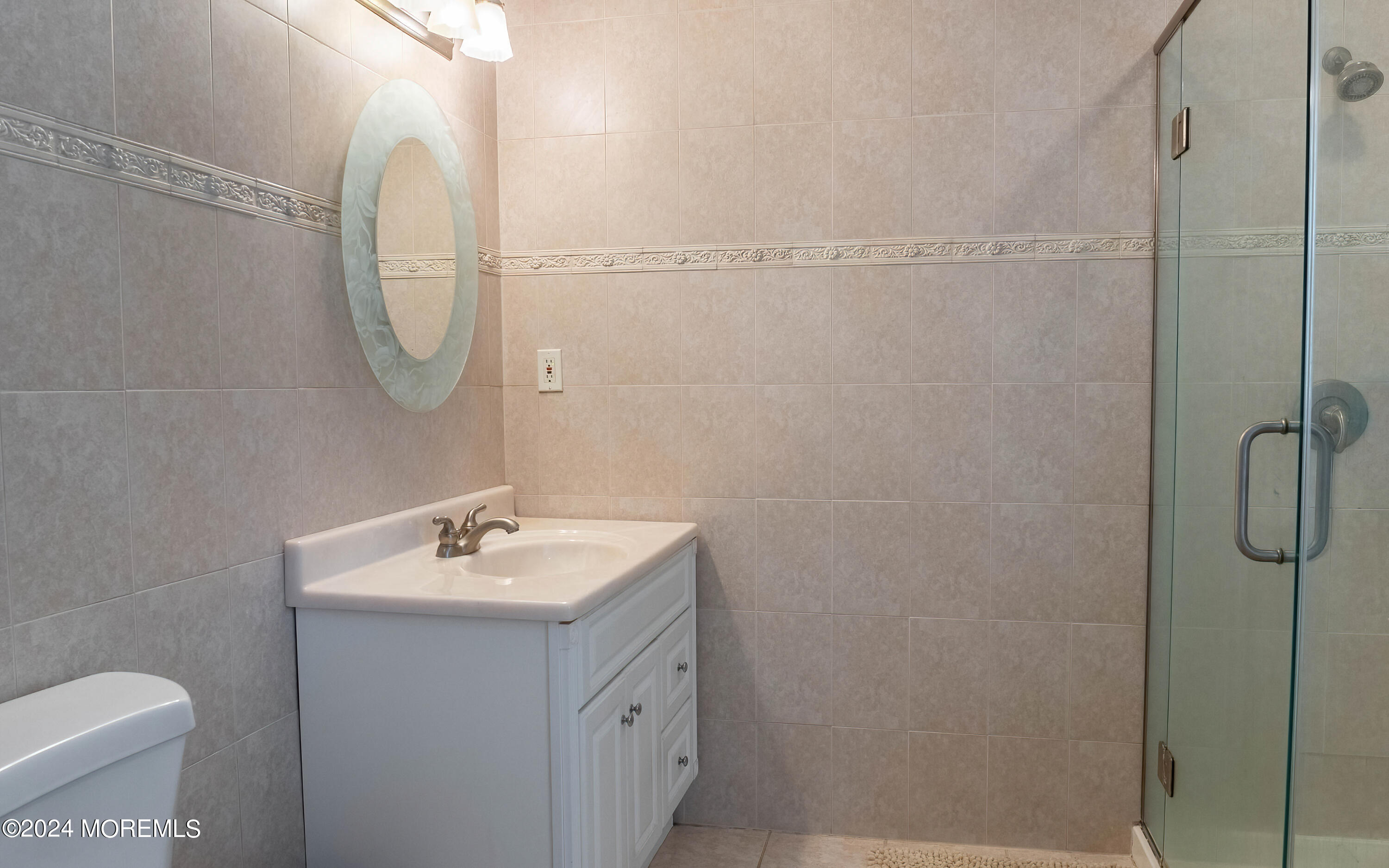 240 Eastham Road Point Pleasant, NJ 08742 - Photo 17 of 44 a bathroom with a sink a toilet and shower