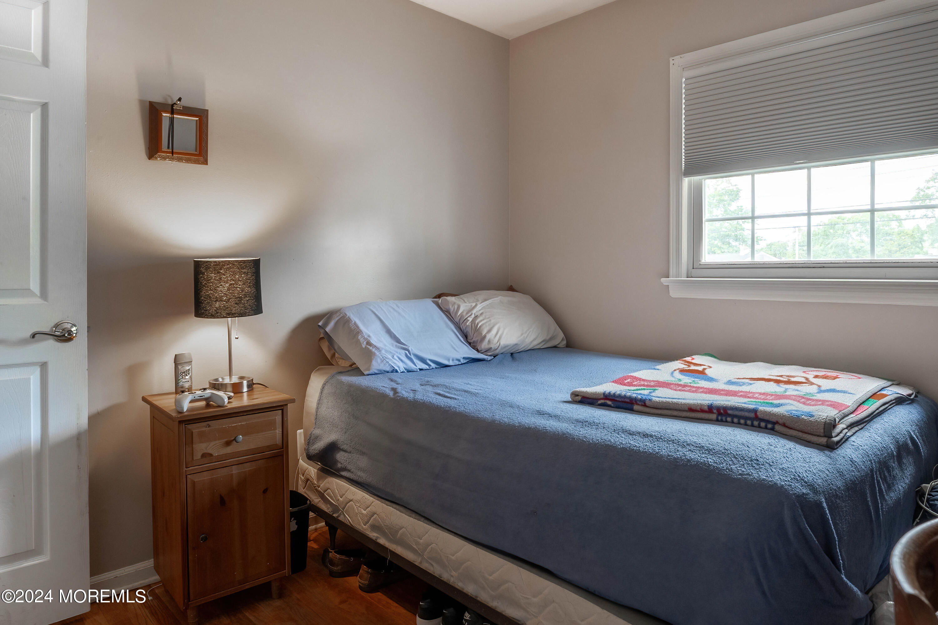240 Eastham Road Point Pleasant, NJ 08742 - Photo 22 of 44 a bedroom with a bed and a window