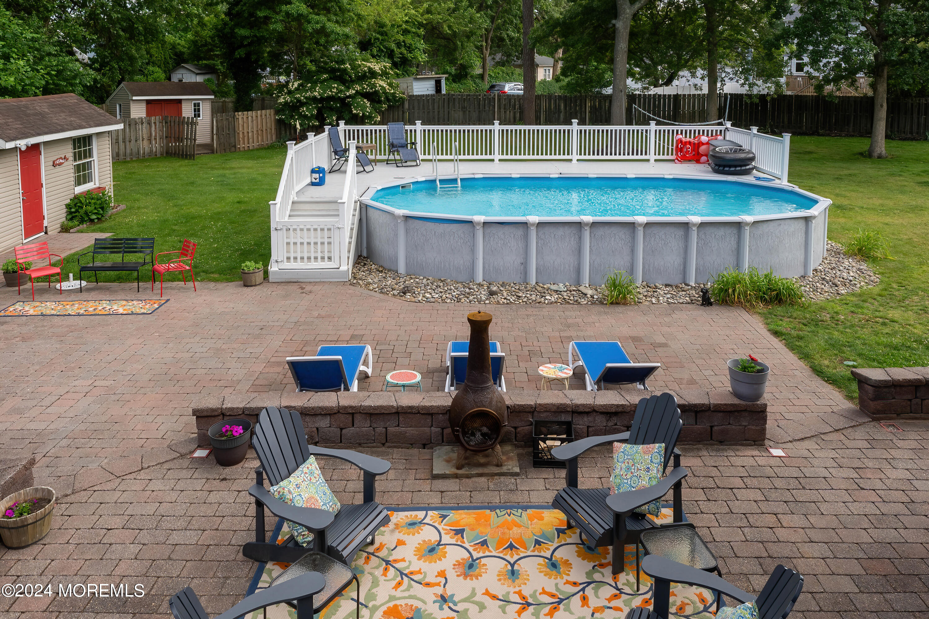 240 Eastham Road Point Pleasant, NJ 08742 - Photo 36 of 44 a view of backyard with swimming pool table and chairs