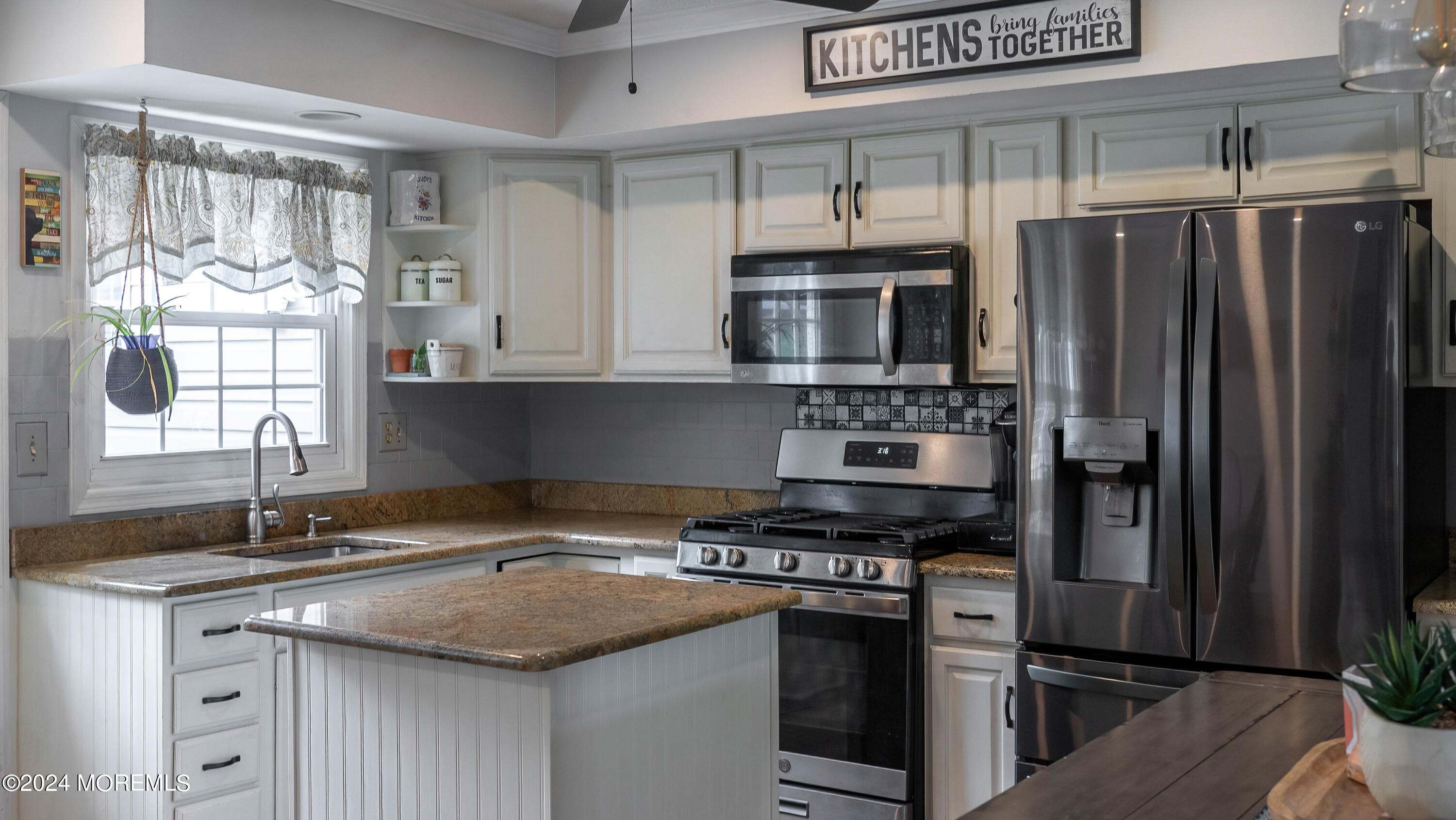 240 Eastham Road Point Pleasant, NJ 08742 - Photo 9 of 44 a kitchen with stainless steel appliances granite countertop a sink stove and refrigerator