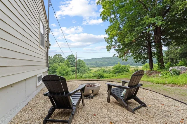 an aerial view of a house with outdoor space