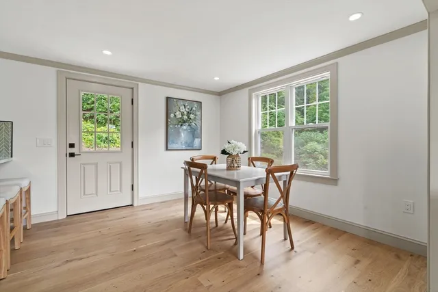 a view of a dining room with furniture window and outside view