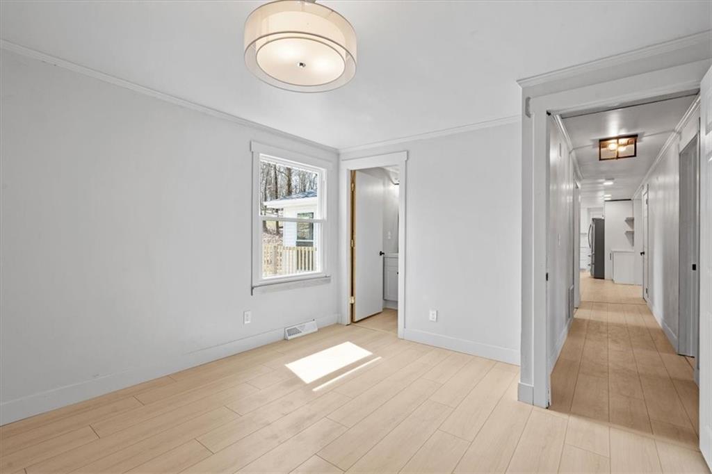 319 Gringo Independence Road Aliquippa, PA 15001 - Photo 13 of 25 a view of empty room with wooden floor