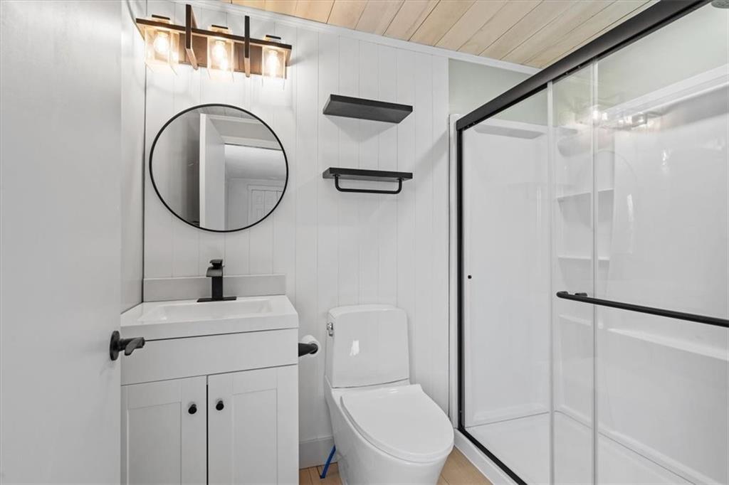319 Gringo Independence Road Aliquippa, PA 15001 - Photo 14 of 25 a bathroom with a toilet sink vanity and mirror