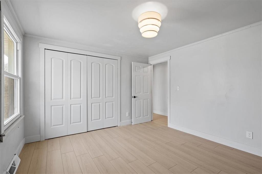 319 Gringo Independence Road Aliquippa, PA 15001 - Photo 16 of 25 a view of empty room with wooden floor and fan