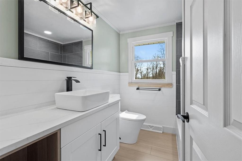 319 Gringo Independence Road Aliquippa, PA 15001 - Photo 19 of 25 a bathroom with a toilet a sink and mirror